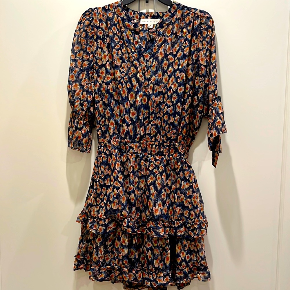 Love stitch size medium blue ruffle dress with elastic waist.